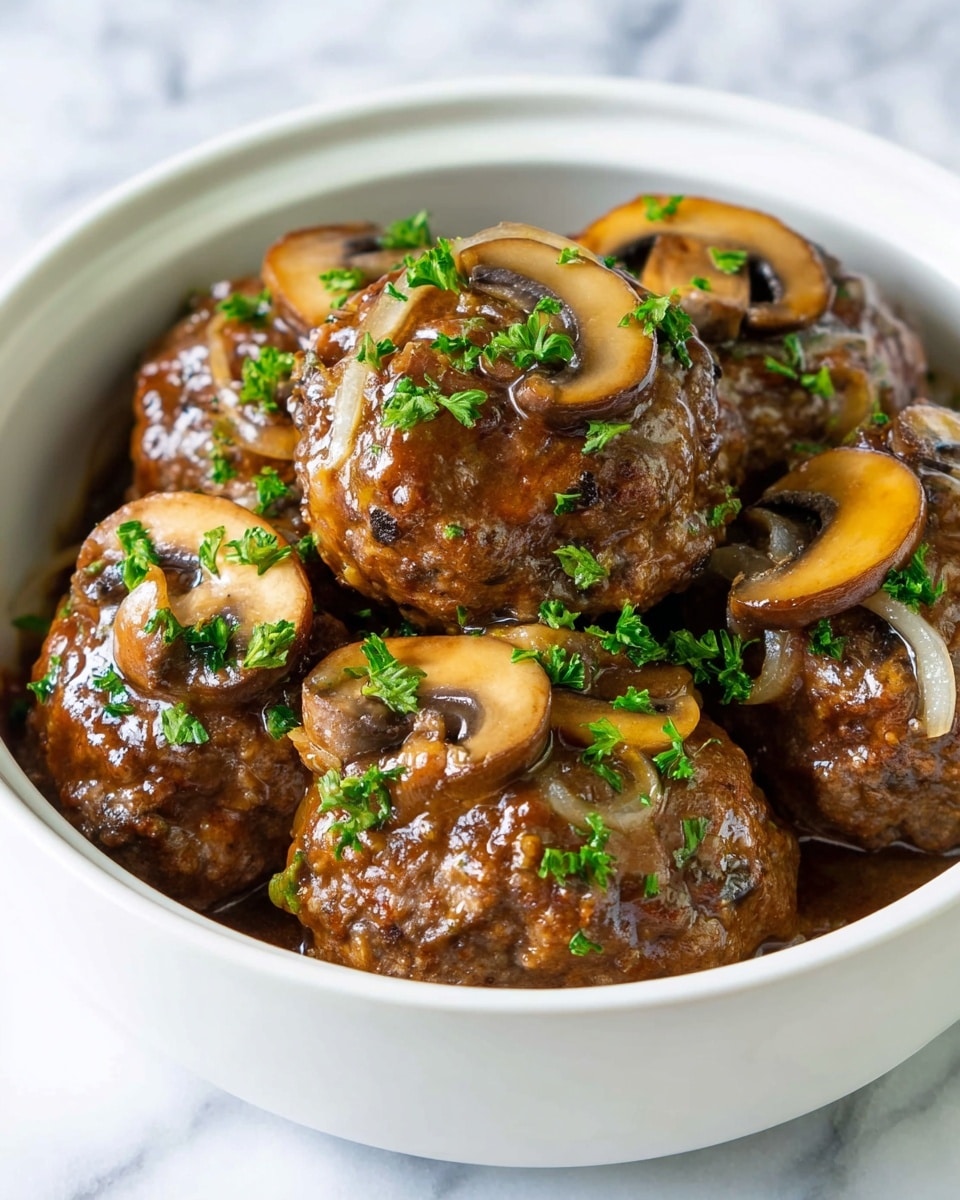 The image shows a white bowl filled with several thick, round cooked meat patties covered in a shiny brown sauce. On top and around the patties are light brown, sliced mushrooms and some thin, pale onion strips. Bright green parsley leaves and small chopped pieces are scattered across the dish, adding a pop of color. The bowl is placed on a white marbled surface, giving a clean and simple look. photo taken with an iphone --ar 4:5 --v 7