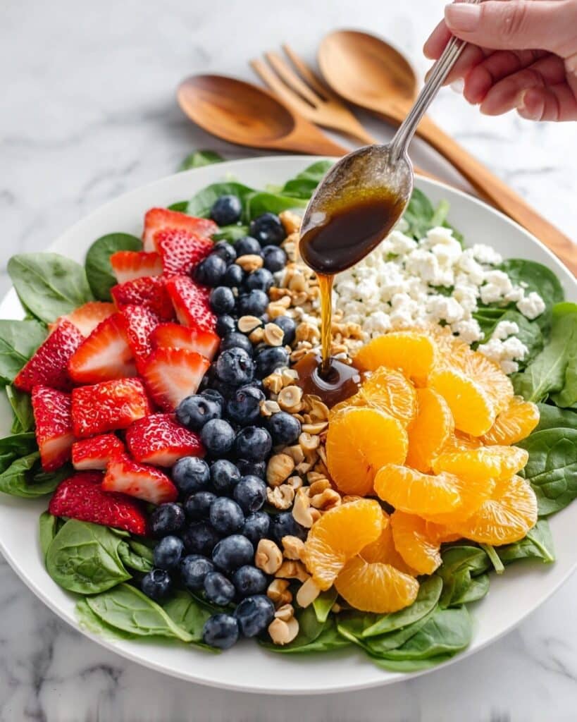 Sweet and Savory Spinach Salad with Berries, Feta, and Honey Roasted Peanuts Recipe