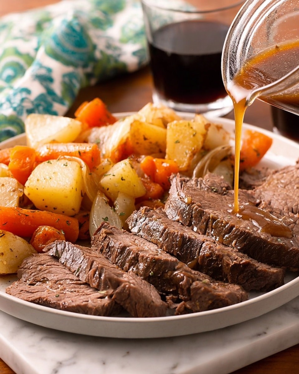 A white plate filled with several thick slices of cooked beef roast in the foreground, showing a rich brown color with visible texture and bits of herbs on top. Behind the beef, there are chunky roasted vegetables including baby potatoes and large carrot pieces that have a warm golden-orange tone, mixed with some onion slices. A brown gravy is being poured over the slices of beef from a small glass container visible on the right side. The scene is set on a white marbled textured surface, with a glass of dark liquid and a folded cloth with green and blue pattern blurred in the background. photo taken with an iphone --ar 4:5 --v 7