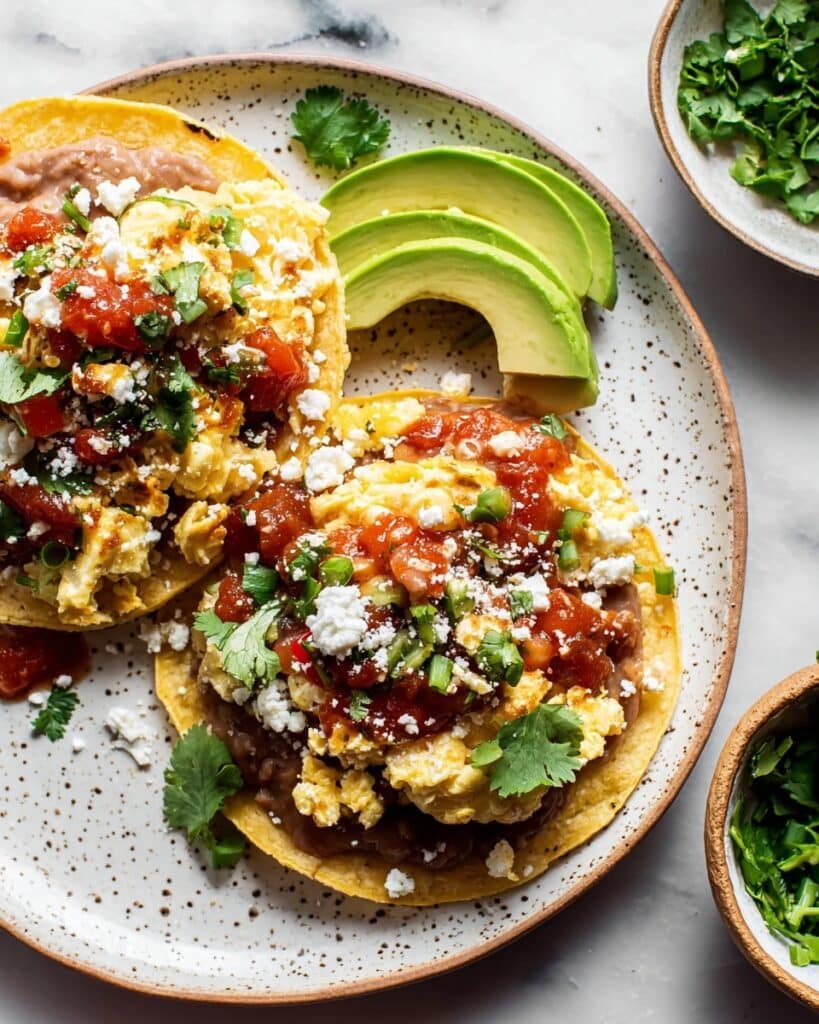 Breakfast Tostadas with Scrambled Eggs, Refried Beans, and Fresh Toppings Recipe