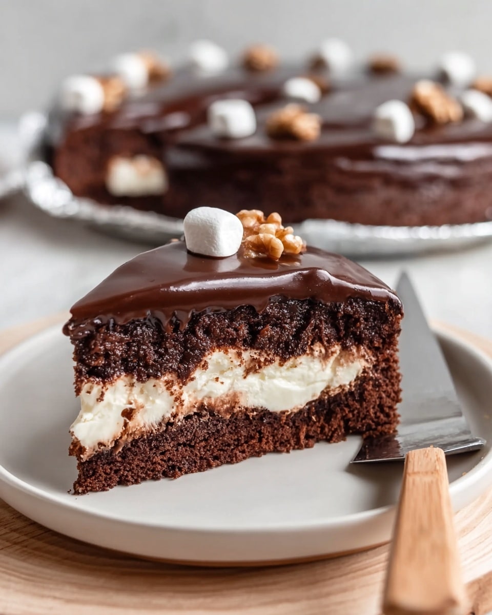 A slice of chocolate cake is shown on a white plate with a wooden texture. The cake has three layers: the bottom layer is a dark, moist chocolate crumb, the middle layer is a thick white cream filling, and the top layer is a smooth, shiny dark chocolate ganache. Small marshmallows and a walnut piece are placed on the ganache. A cake server with a light wooden handle rests beside the slice. In the background, a whole cake with similar decoration is in a silver foil pan, all set on a white marbled surface. Photo taken with an iphone --ar 4:5 --v 7