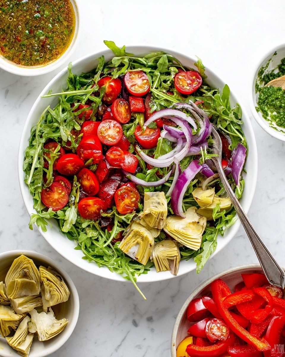 A white bowl filled with a fresh salad containing three main layers: a base of dark green arugula leaves that are slightly curly and textured, scattered bright red halved cherry tomatoes with juicy interiors, and light yellowish artichoke hearts quartered and placed evenly on top. There are thin slices of pale purple red onions mixed throughout and bright red strips of roasted bell peppers adding pops of color. A silver fork rests inside the bowl on the right side. Around the bowl on a white marbled surface, there are small white bowls with additional artichokes, strips of roasted red peppers, sliced cherry tomatoes, and a bowl with a greenish herb dressing. Photo taken with an iphone --ar 4:5 --v 7