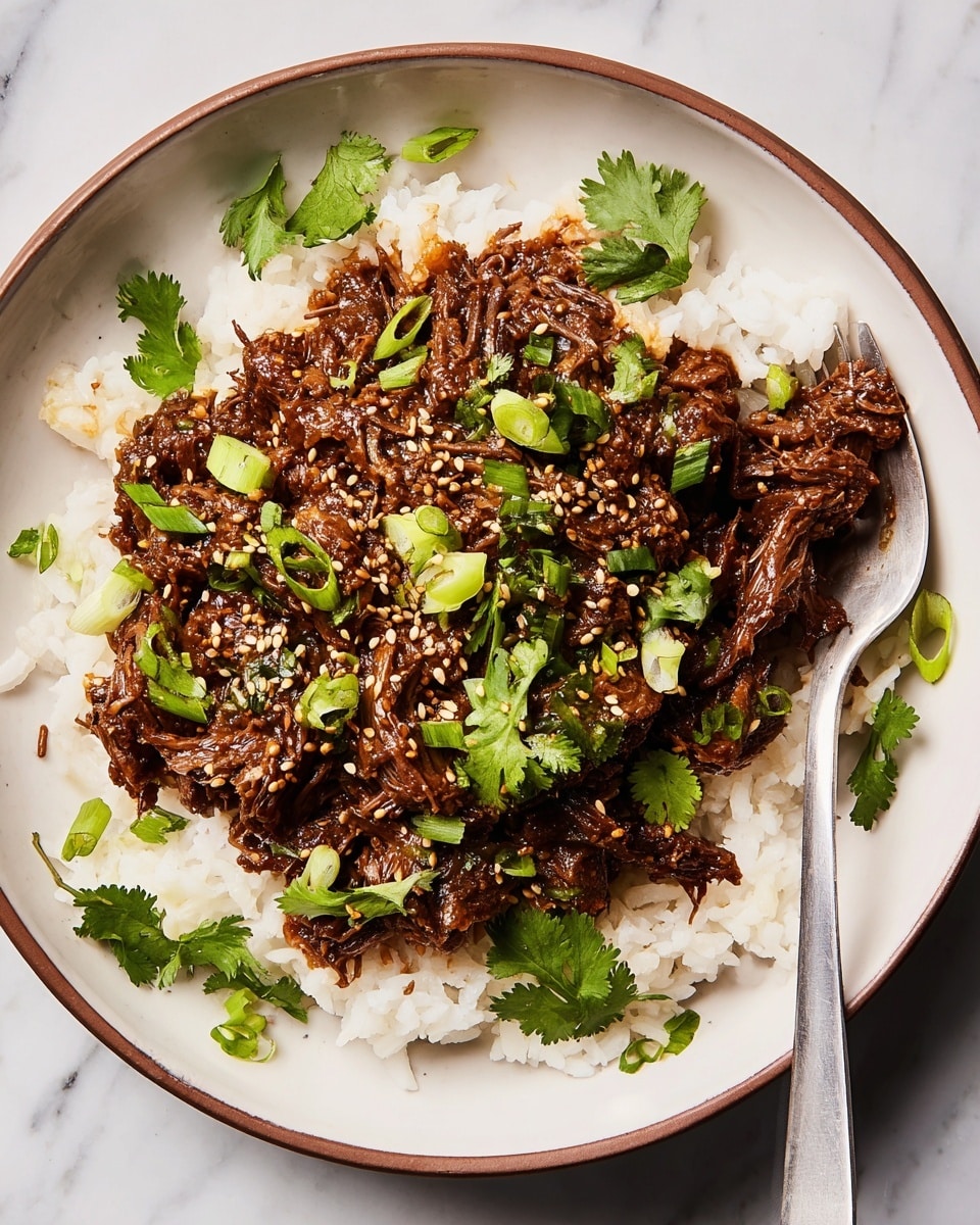 The image shows a white oval dish filled with shredded meat in a rich, dark brown sauce. The meat appears tender and moist, with visible fibers and chunks mixed together. The sauce glistens, covering the meat evenly and giving a glossy finish. A silver spoon dips into the dish from the bottom right corner, partially submerged in the sauce. In the top left part of the image, there is a white bowl with chopped green onions on a white marbled surface. The overall scene is bright and focuses on the rich texture and color of the meat dish. photo taken with an iphone --ar 4:5 --v 7