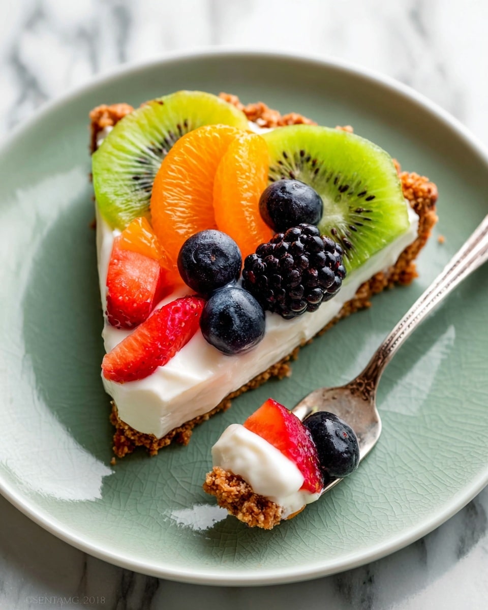 A slice of fruit tart with three visible layers on a white plate: the bottom layer is a crumbly brown crust, the middle layer is smooth white cream, and the top layer is a colorful mix of fresh fruit including two bright green kiwi slices, one shiny orange mandarin segment, two red strawberry slices, a few dark purple-blue blueberries, and shiny black blackberries. A silver fork holding a small piece of tart with cream and a blueberry rests next to the slice. The plate sits on a white marbled surface. photo taken with an iphone --ar 4:5 --v 7
