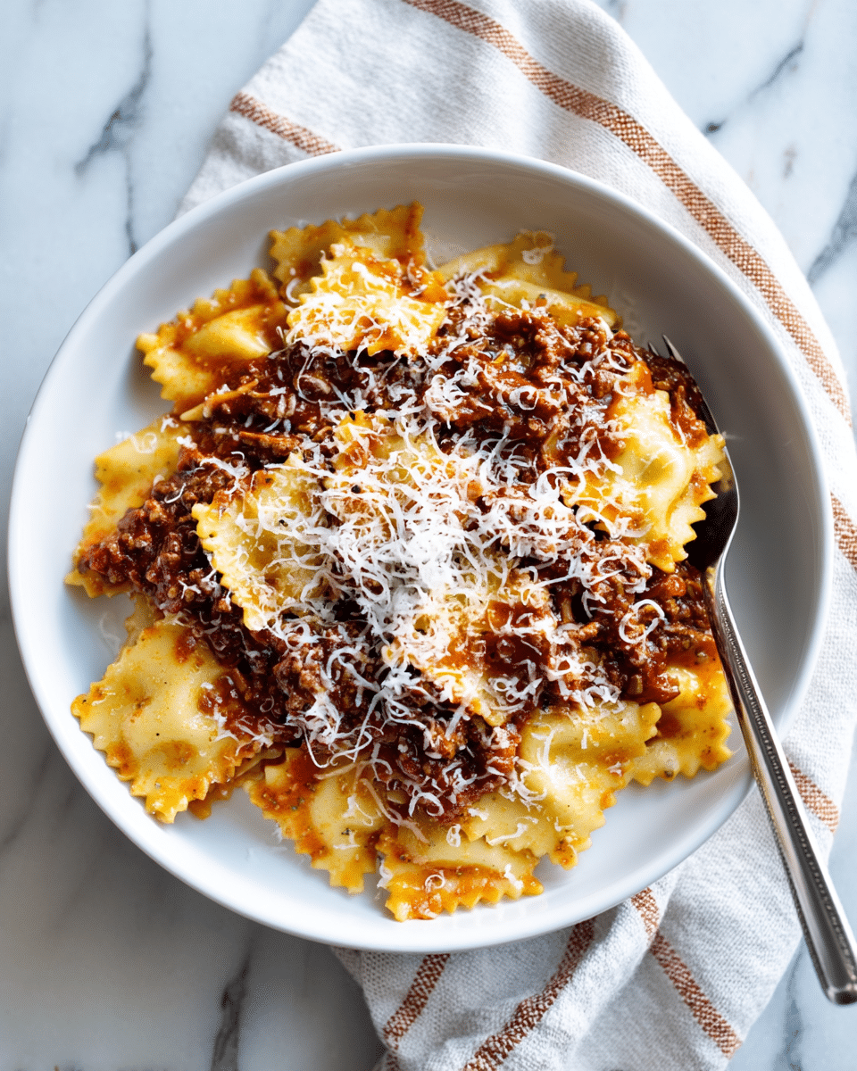 A white bowl filled with multiple wide, flat pasta layers at the bottom, light golden in color with a slightly rough texture, topped unevenly with a thick, dark brown shredded meat sauce that covers the top and some sides, sprinkled generously with fine, white grated cheese that adds a soft texture, with a silver fork resting inside the bowl on the right side, all set on a white marbled surface with a folded cloth showing white and light brown stripes beside the bowl, photo taken with an iphone --ar 4:5 --v 7