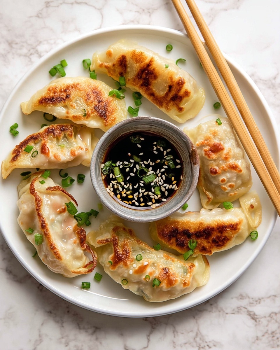 A white plate holds seven pan-fried dumplings arranged around a small, round, grayish dipping bowl filled with a brown sauce topped with chopped green onions. The dumplings have a light golden-brown crispy texture on one side, with soft, translucent, slightly shiny edges. The surface beneath is a white marbled texture, adding a clean and bright feel to the scene. photo taken with an iphone --ar 4:5 --v 7